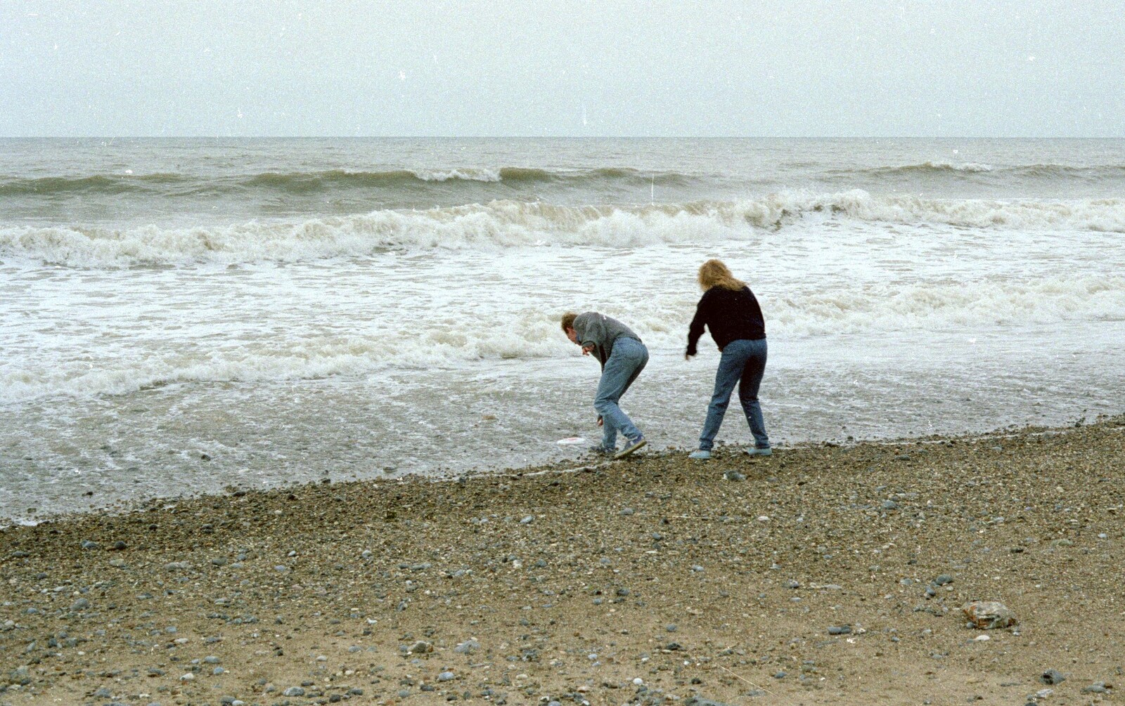 Martin and Emma chuck stones in to the sea from A Trip to the Beach, East Runton, Norfolk - 6th July 1988