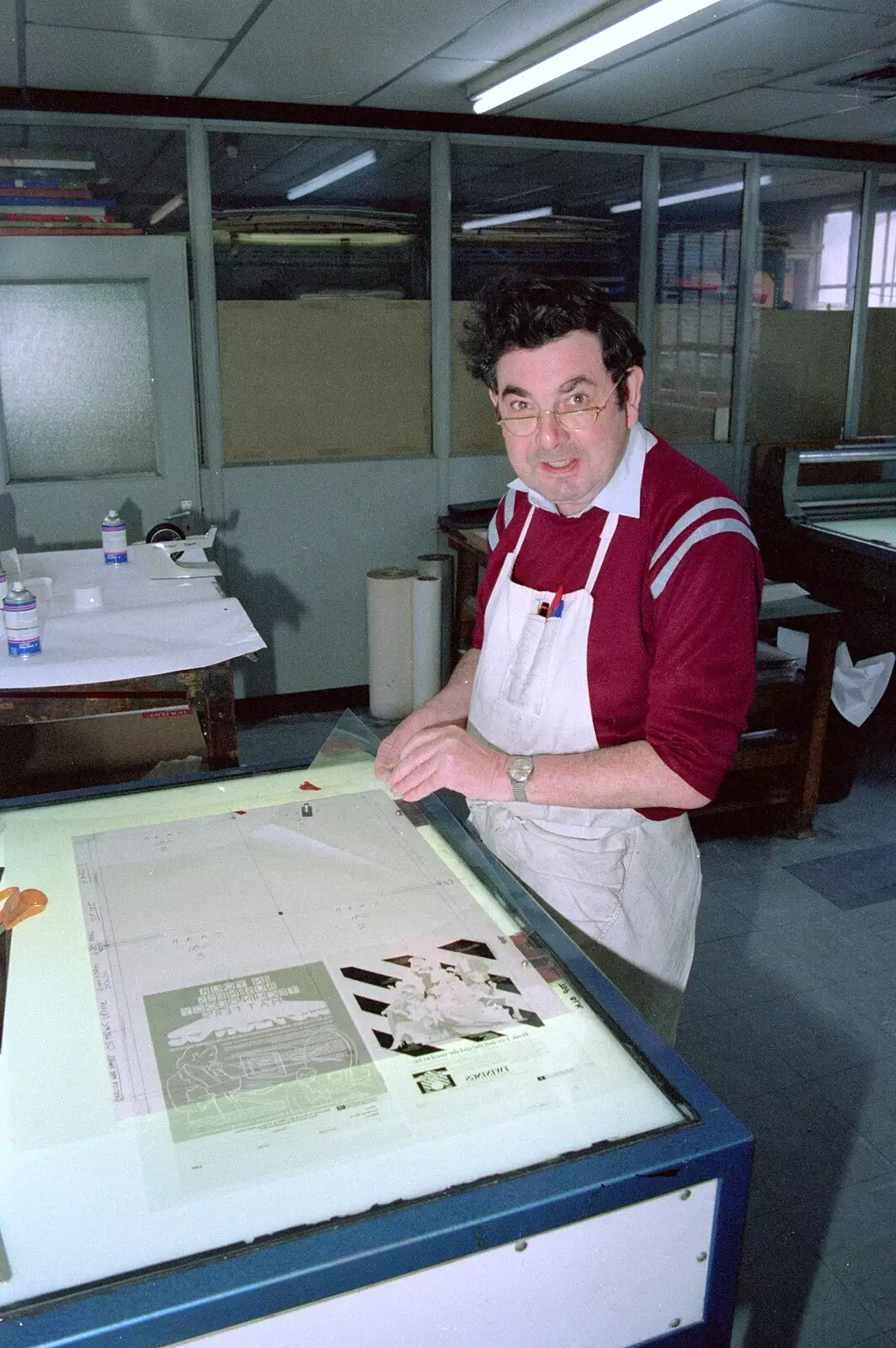 One of the pre-press guys checks out a foil, from Nosher Leaves Soman-Wherry Press, Norwich - 3rd August 1988