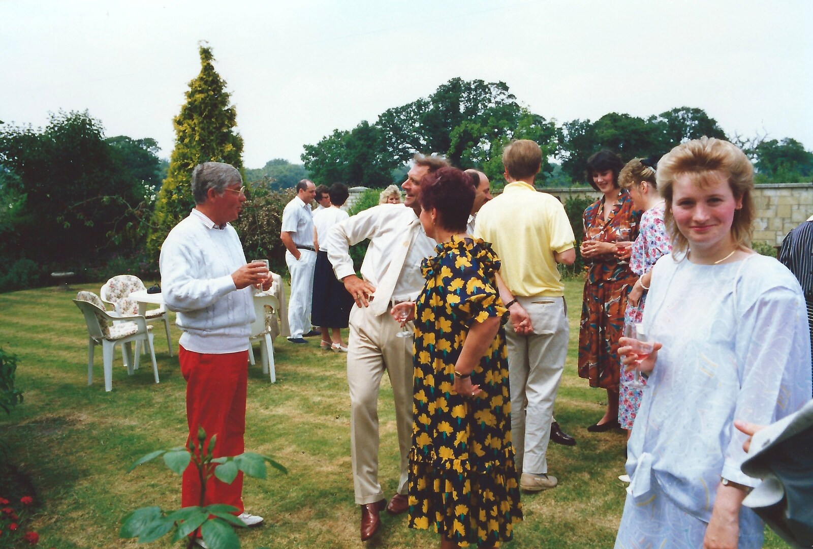 Maria looks over as guests mingle on the lawn from Mother and Mike's Wedding Reception, Bransgore, Dorset - 20th August 1988