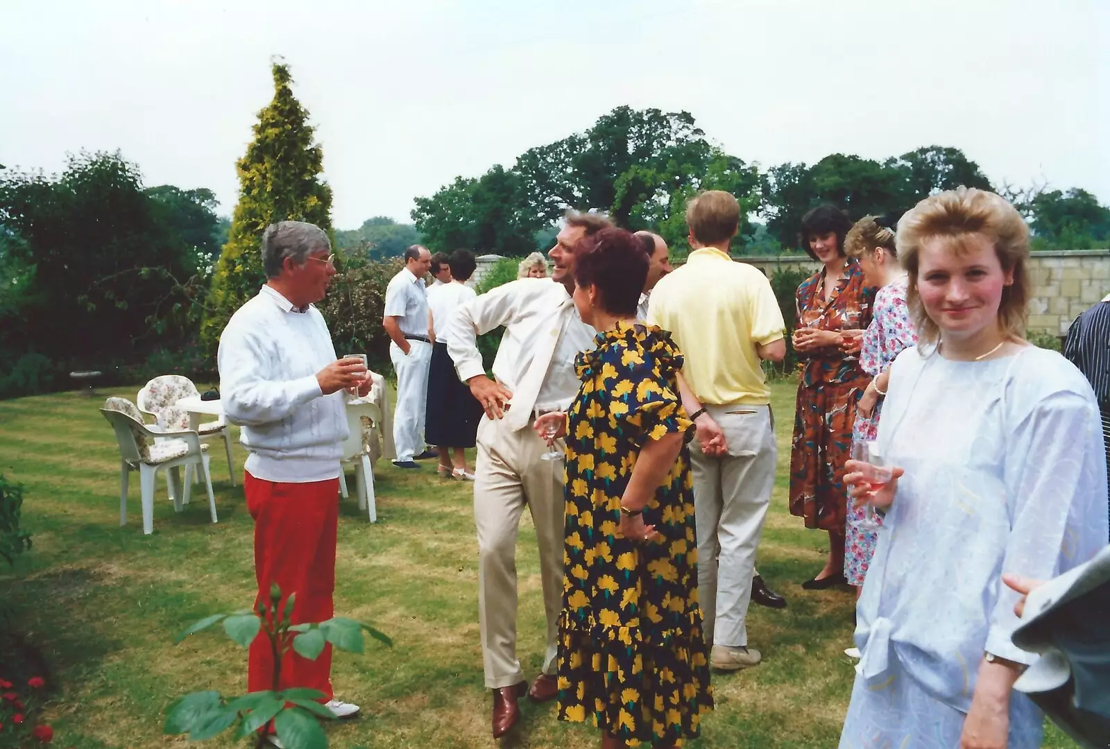 Maria looks over as guests mingle on the lawn, from Mother and Mike's Wedding Reception, Bransgore, Dorset - 20th August 1988