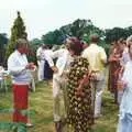 Maria looks over as guests mingle on the lawn, Mother and Mike's Wedding Reception, Bransgore, Dorset - 20th August 1988