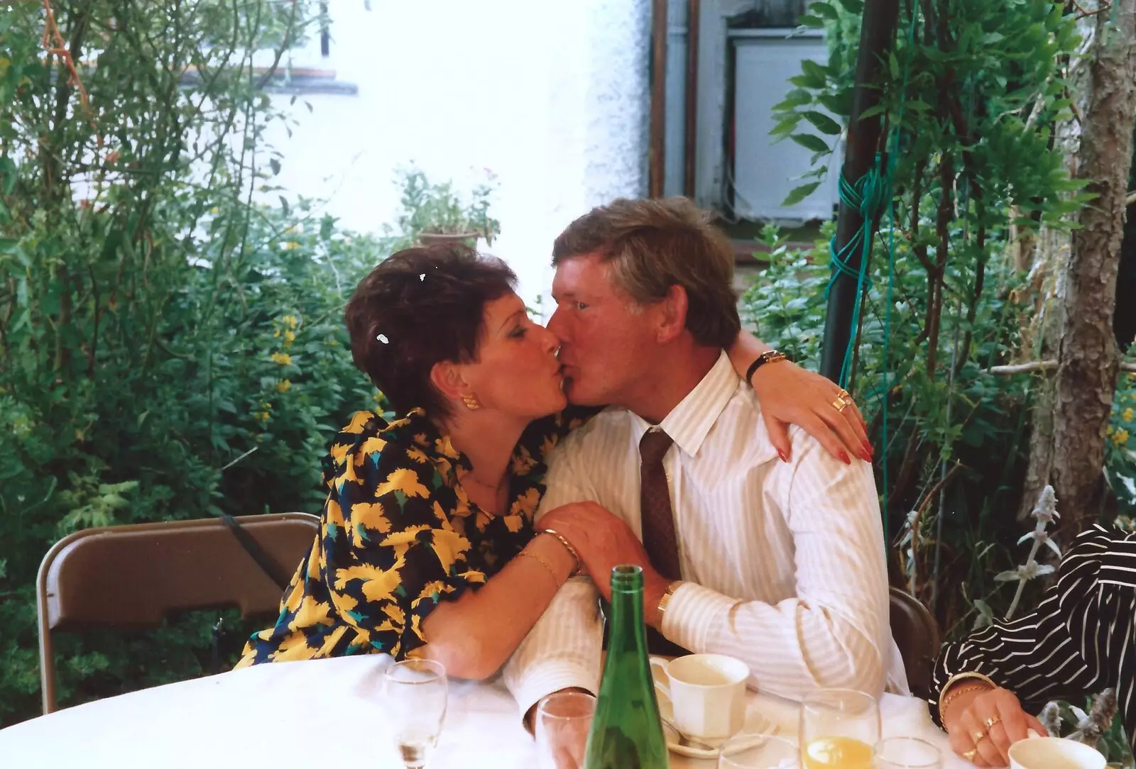 Judith and Brian grab a quick snog, from Mother and Mike's Wedding Reception, Bransgore, Dorset - 20th August 1988