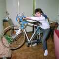 Sean rides Nosher's bike in his lounge, Leaving Sewell's Cottages: from Red House to New Milton and Farnborough - 22nd September 1988