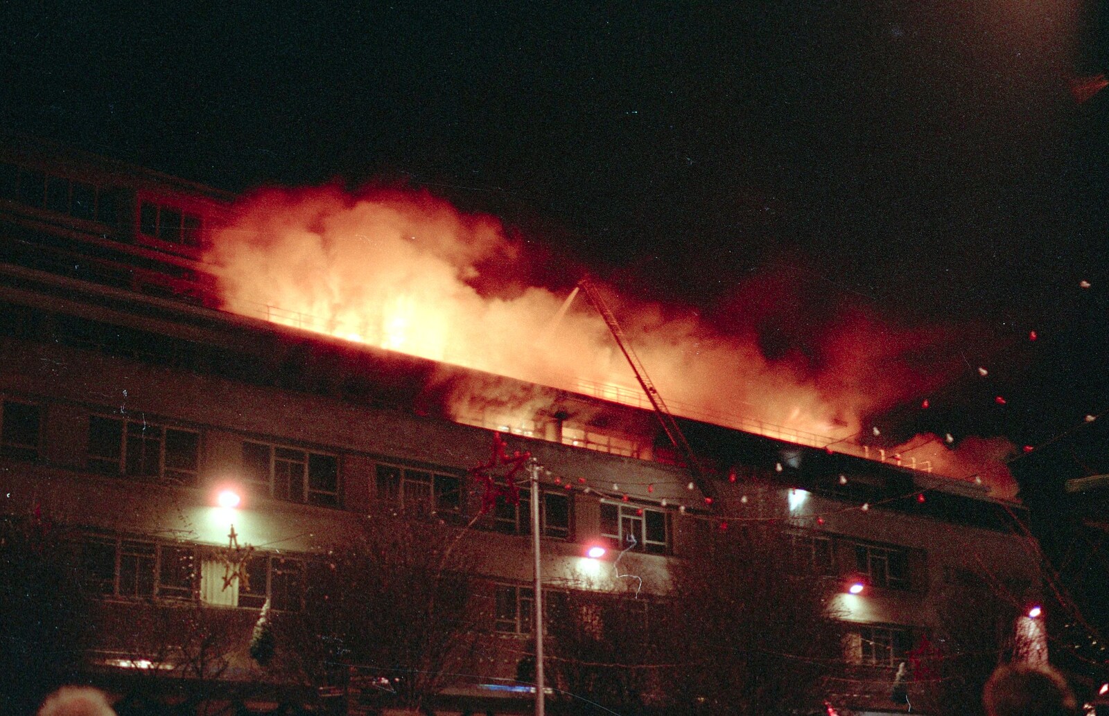 Ladder-mounted hoses douse the flames from Uni: The Fire-Bombing of Dingles, Plymouth, Devon - 19th December 1988