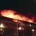 Ladder-mounted hoses douse the flames, Uni: The Fire-Bombing of Dingles, Plymouth, Devon - 19th December 1988