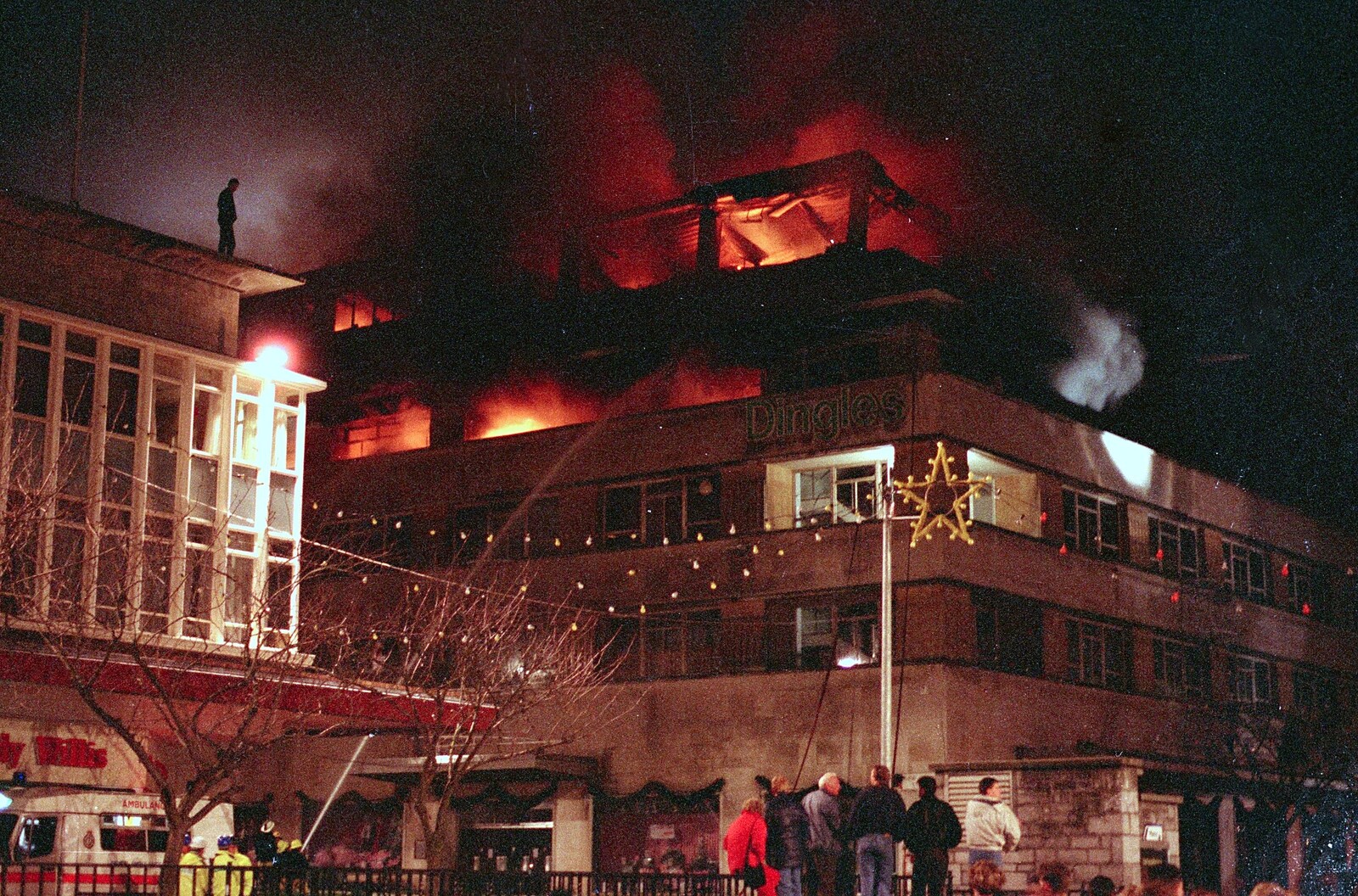 A dude stands on the roof of the opposite building from Uni: The Fire-Bombing of Dingles, Plymouth, Devon - 19th December 1988
