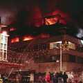A dude stands on the roof of the opposite building, Uni: The Fire-Bombing of Dingles, Plymouth, Devon - 19th December 1988