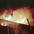 Flames curl out of the top floor, Uni: The Fire-Bombing of Dingles, Plymouth, Devon - 19th December 1988