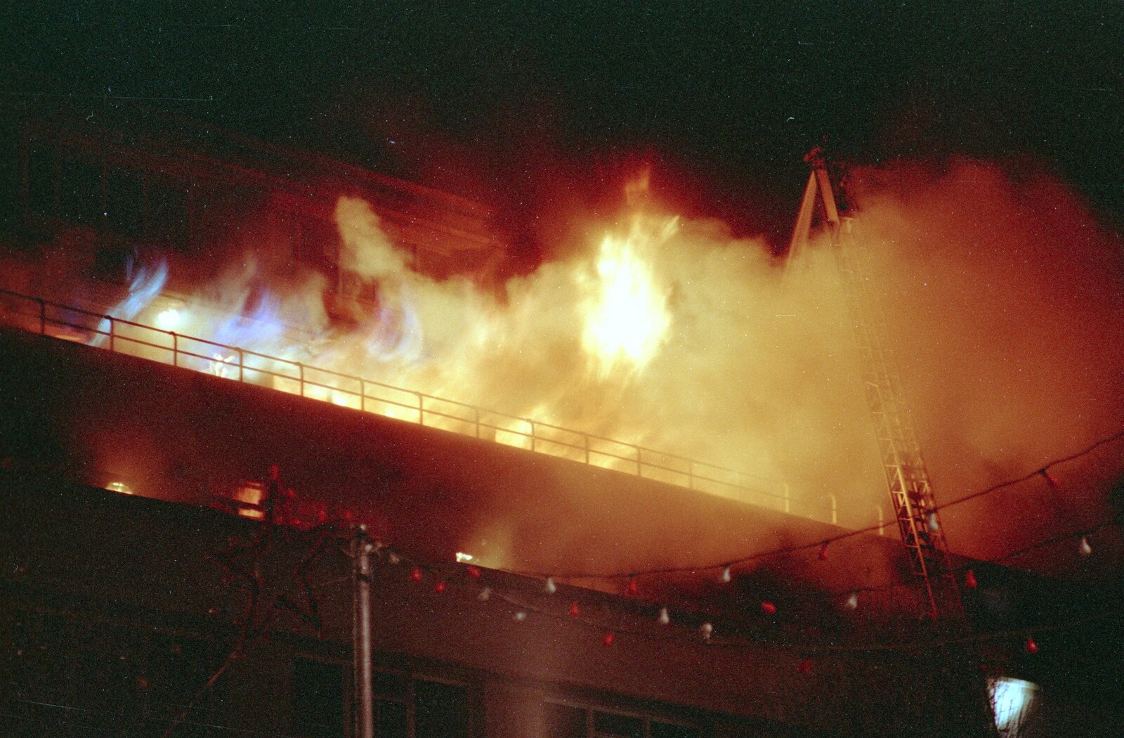 Hot blue flames burst out of the top floor of Dingles from Uni: The Fire-Bombing of Dingles, Plymouth, Devon - 19th December 1988