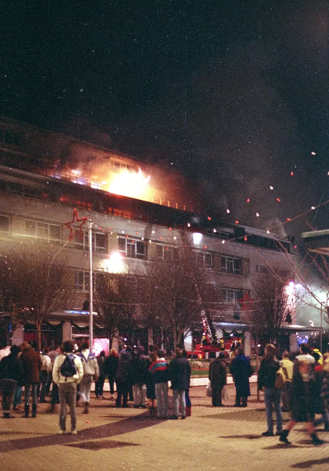 Crowds look on as the flames get hotter, from Uni: The Fire-Bombing of Dingles, Plymouth, Devon - 19th December 1988