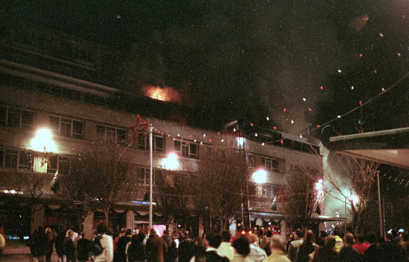 Smoke billows out of the roof from Uni: The Fire-Bombing of Dingles, Plymouth, Devon - 19th December 1988