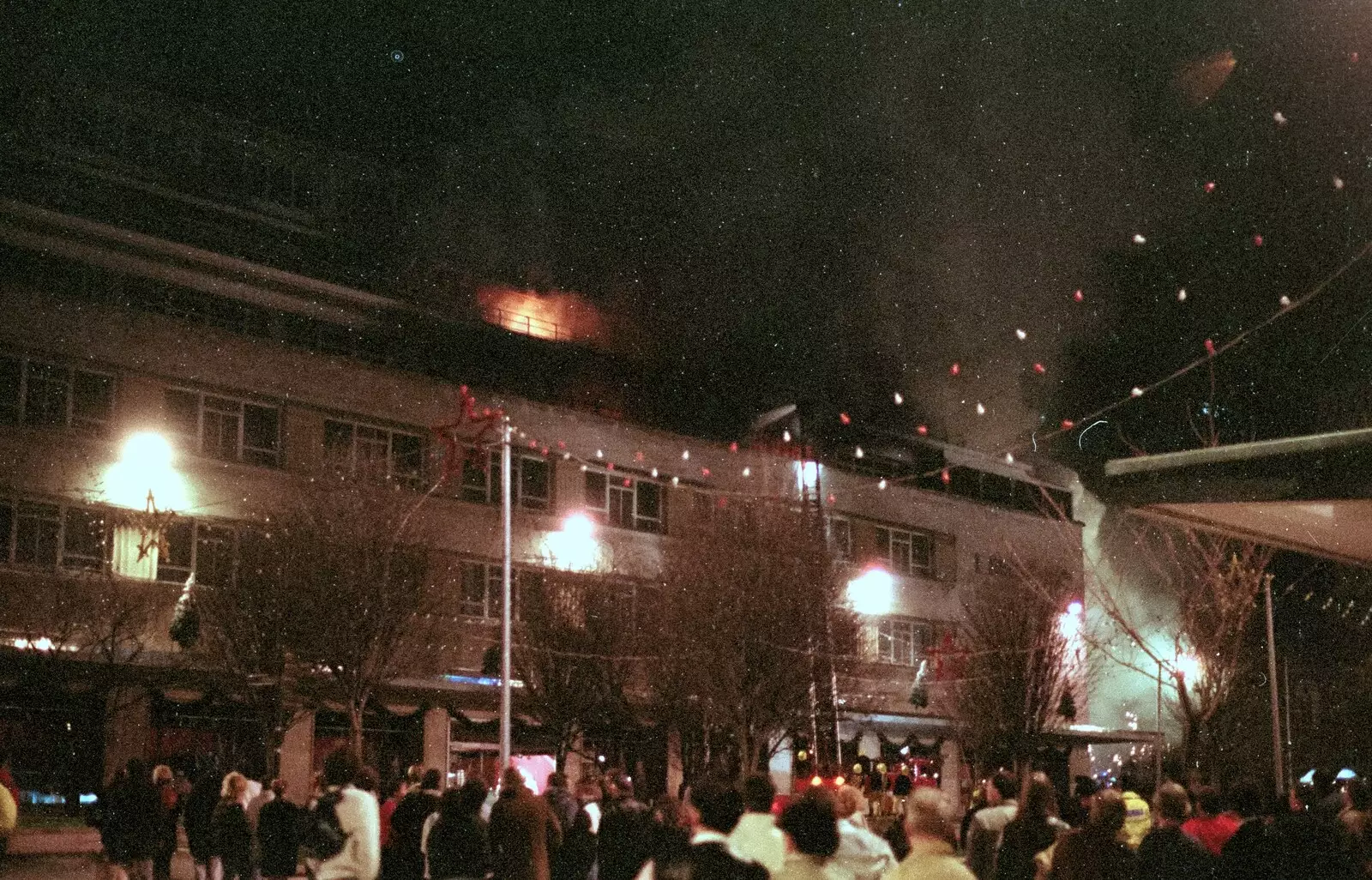 Smoke billows out of the roof, from Uni: The Fire-Bombing of Dingles, Plymouth, Devon - 19th December 1988