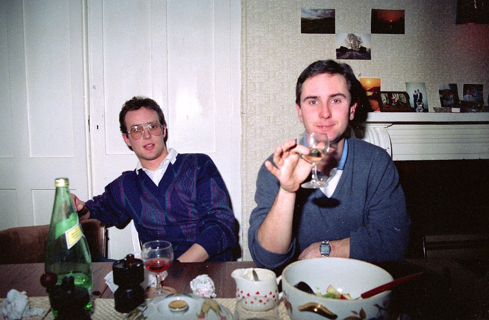 Riki holds up a glass of wine from Uni: A Dinner Party, Harbertonford and Buckfastleigh, Devon - 24th December 1988