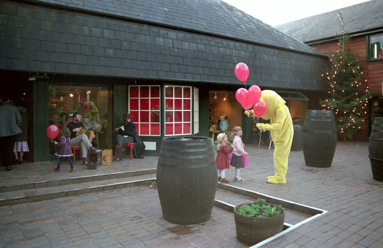 Balloons are handed out, from Uni: A Dinner Party, Harbertonford and Buckfastleigh, Devon - 24th December 1988