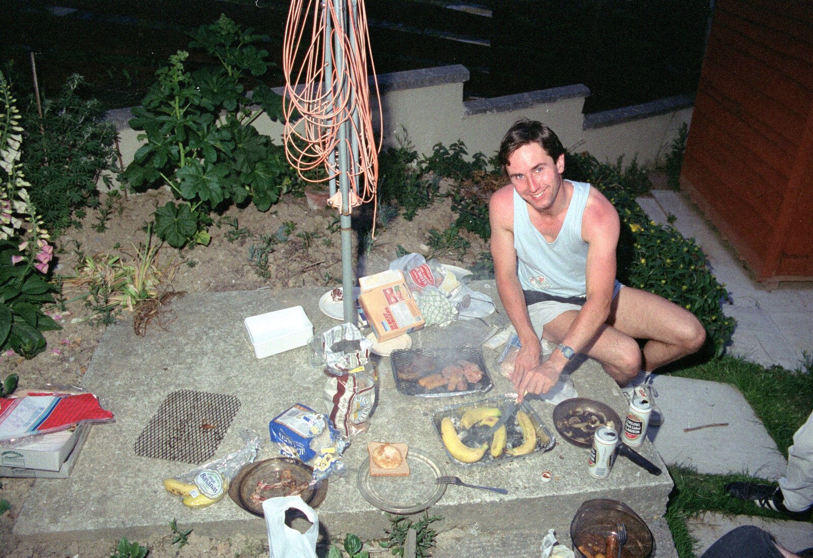 Riki cooks up some burgers and bananas from Uni: Riki's Barbeque and Dobbs' Jitsu, Plymouth, Devon - 2nd June 1989