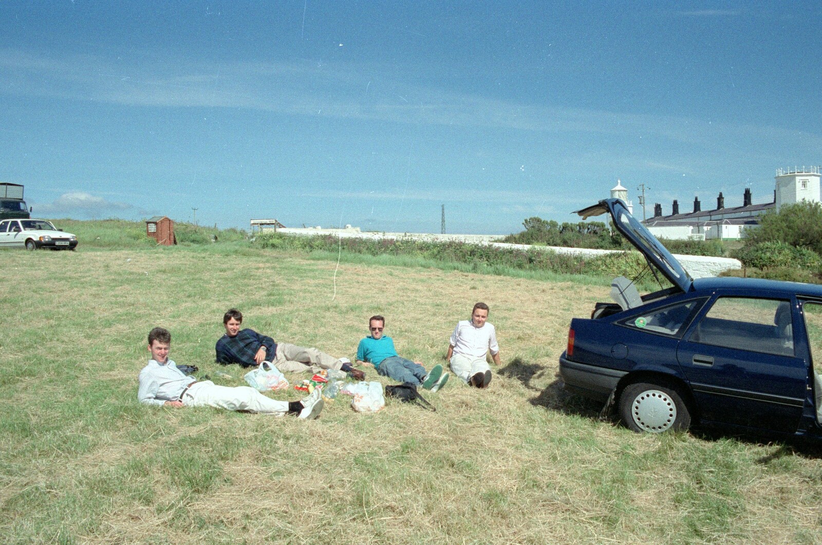 John, Riki, Chris and Andy flake out on the grass at the Lizard from Uni: An End-of-it-all Trip to Land's End, Cornwall - 13th June 1989