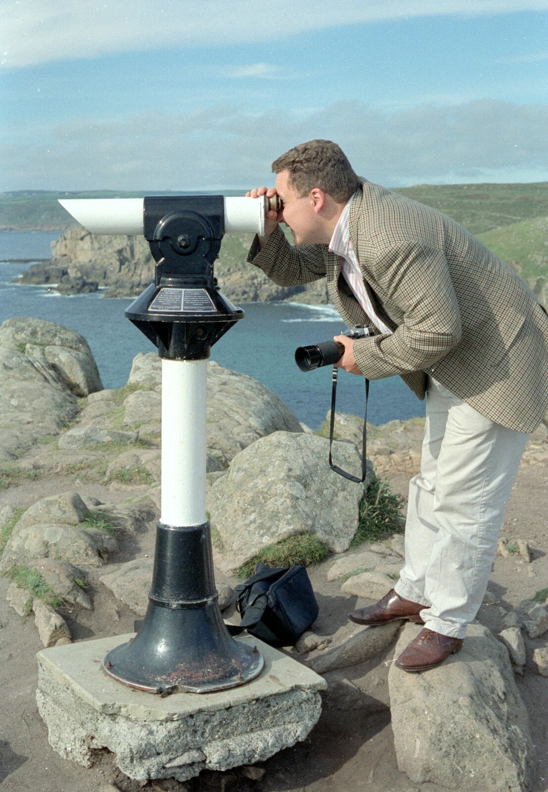 Andy peers through a telescope from Uni: An End-of-it-all Trip to Land's End, Cornwall - 13th June 1989