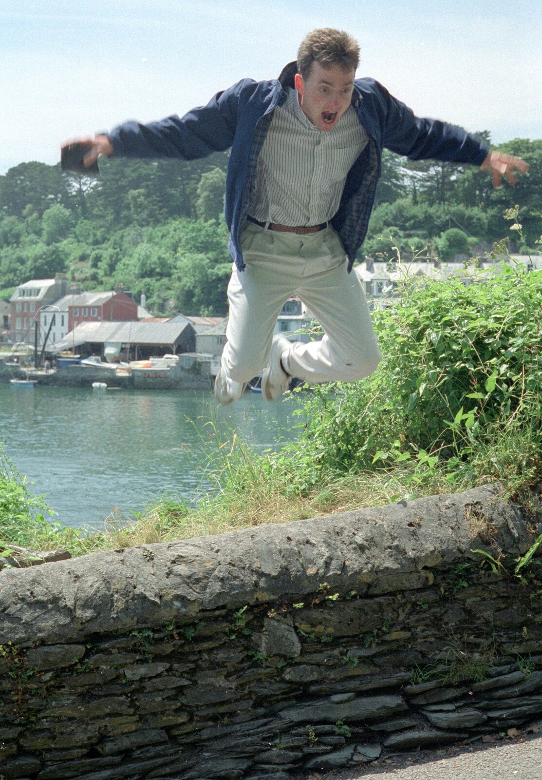 John Stuart leaps off a wall from Uni: An End-of-it-all Trip to Land's End, Cornwall - 13th June 1989