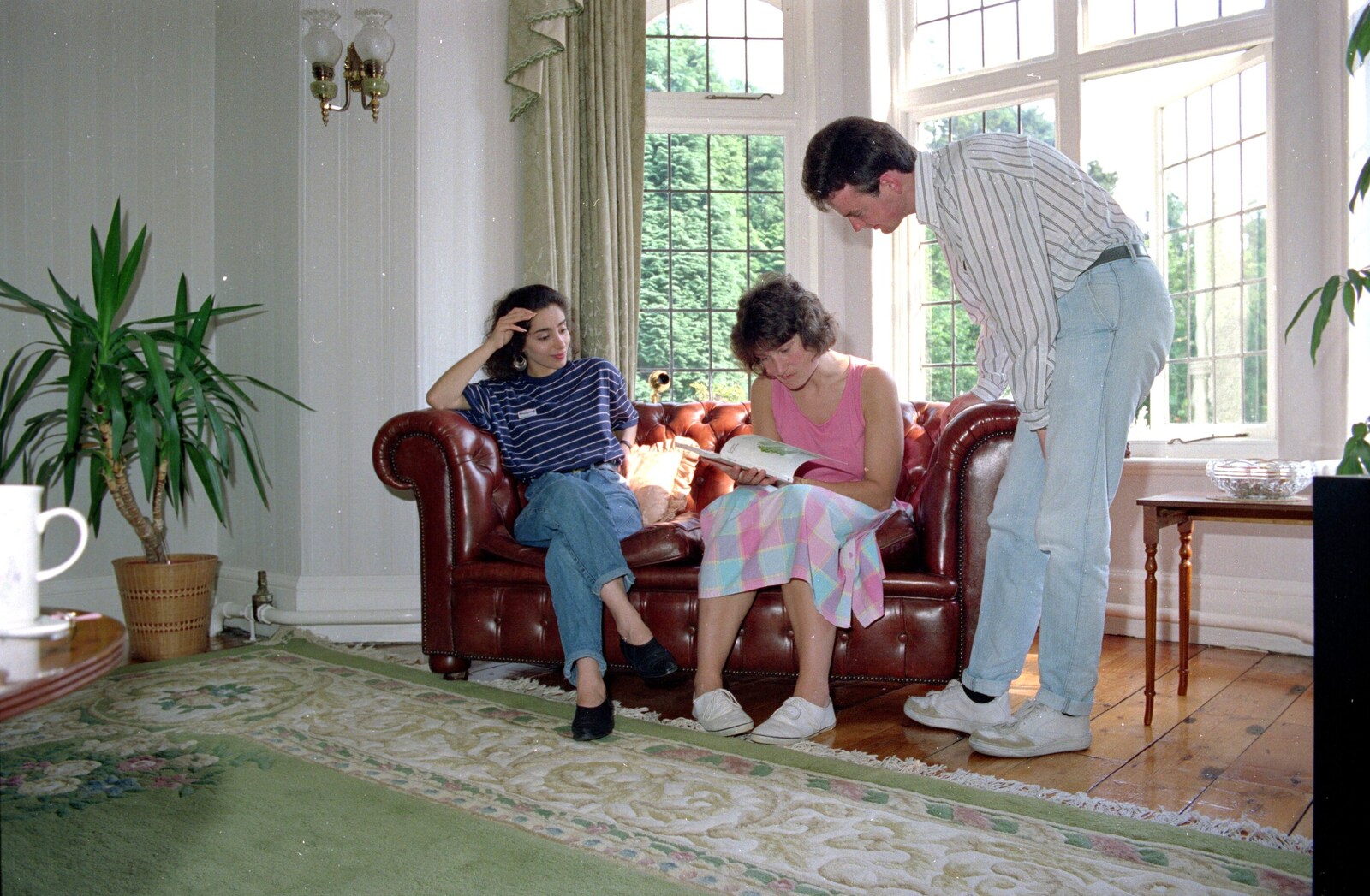 Angela reads something as Hoorie and John look on from Uni: Another Side of Student Life, Yelverton, Devon - 23rd June 1989