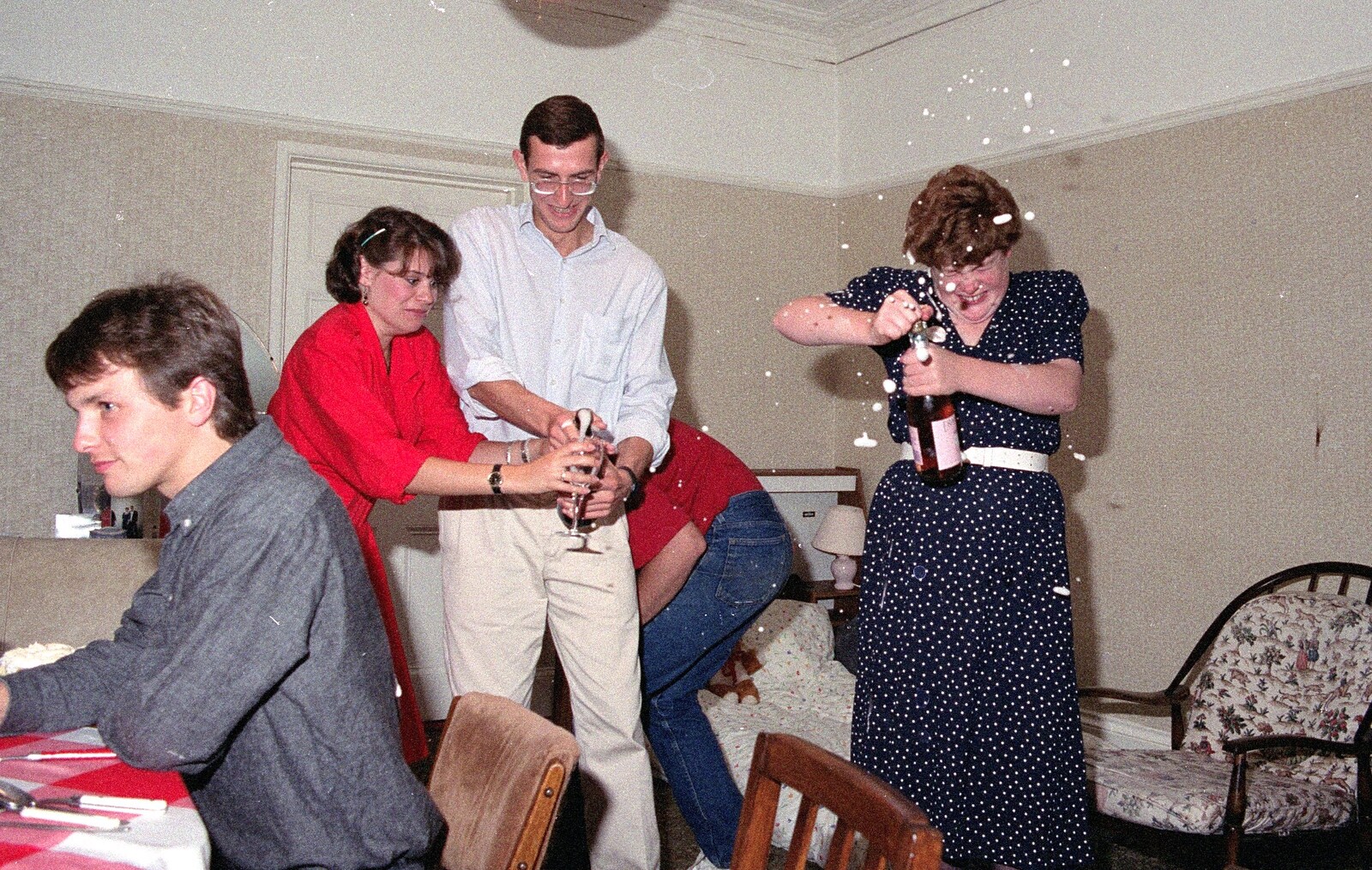 Kate uncorks a bottle of fizz from Uni: A Wyndham Square Economics Party, Stonehouse, Plymouth - 10th July 1989