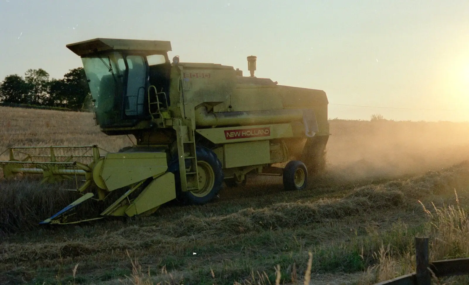 The New Holland Combine trundles around, from Summer Days on Pitt Farm, Harbertonford, Devon - 17th July 1989