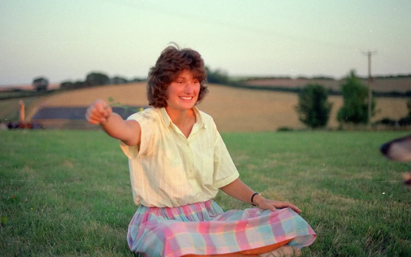 Angela holds out a flower for Marty to chase, from Summer Days on Pitt Farm, Harbertonford, Devon - 17th July 1989