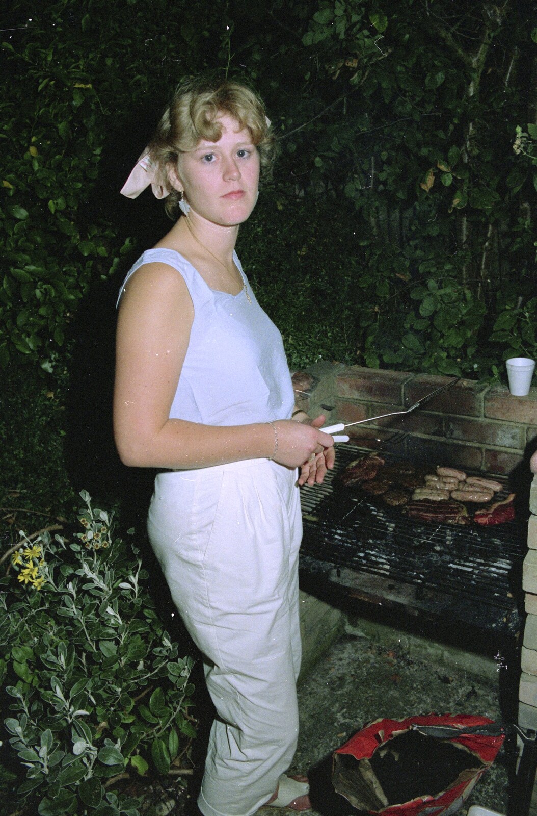 Chris and Phil's Party, Hordle, Hampshire - 6th September 1989: Rosemary looks serious: the fate of the sausages is in the balance