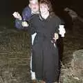 Steve and Sam hold something up, A Stuston Bonfire Night, Suffolk - 5th November 1989