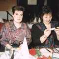 Kelly Pitcher and Wendy Saunders read a motto , BPCC Printec Christmas Do, Harleston Swan - 15th December 1989