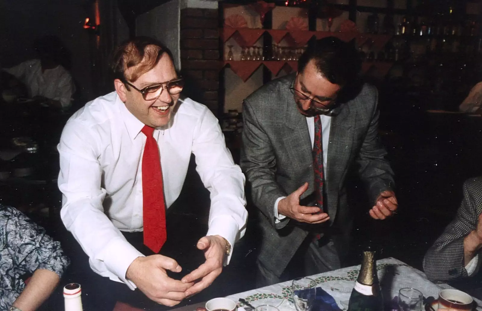 Mike and Brian Williams perform some Welsh rugby ritual, from BPCC Printec Christmas Do, Harleston Swan - 15th December 1989