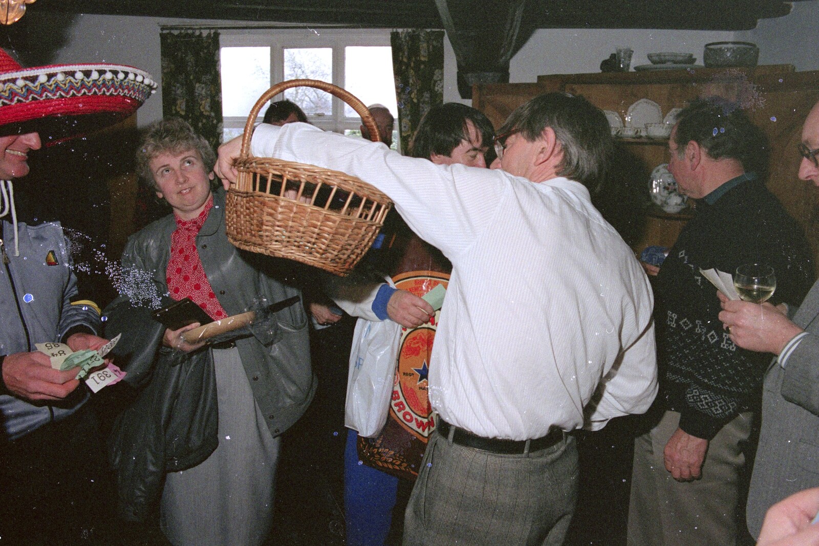 Linda picks a raffle ticket from Pancake Day in Starston, Norfolk - 27th February 1990