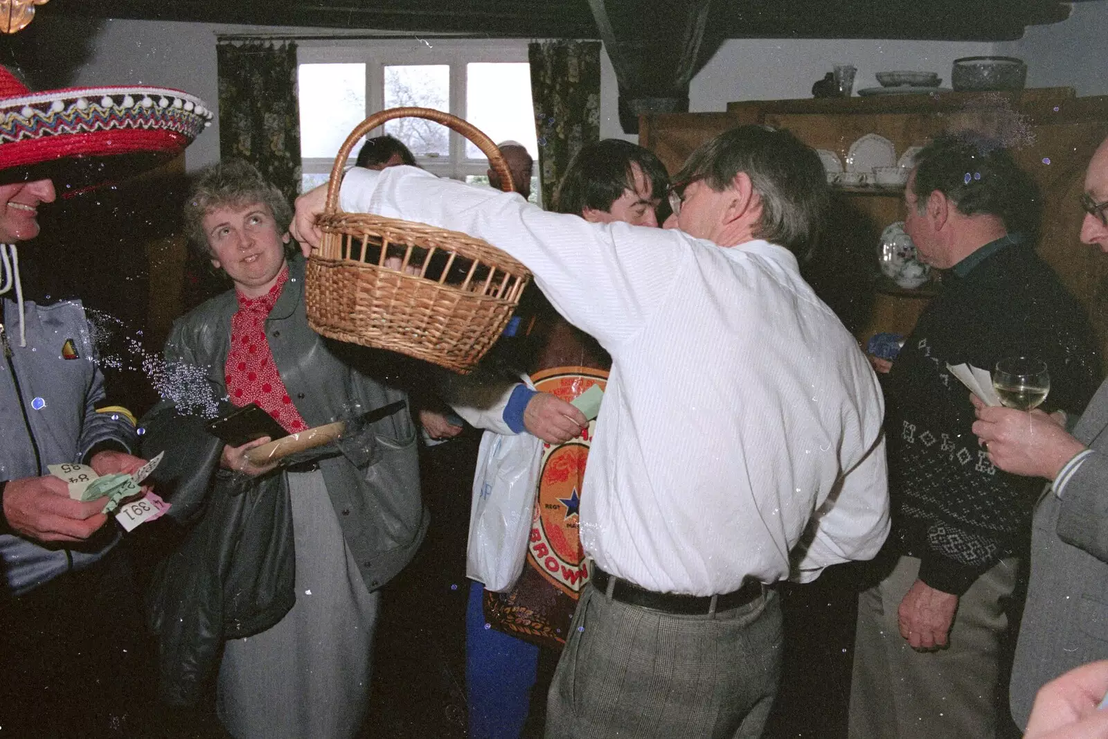 Linda picks a raffle ticket, from Pancake Day in Starston, Norfolk - 27th February 1990