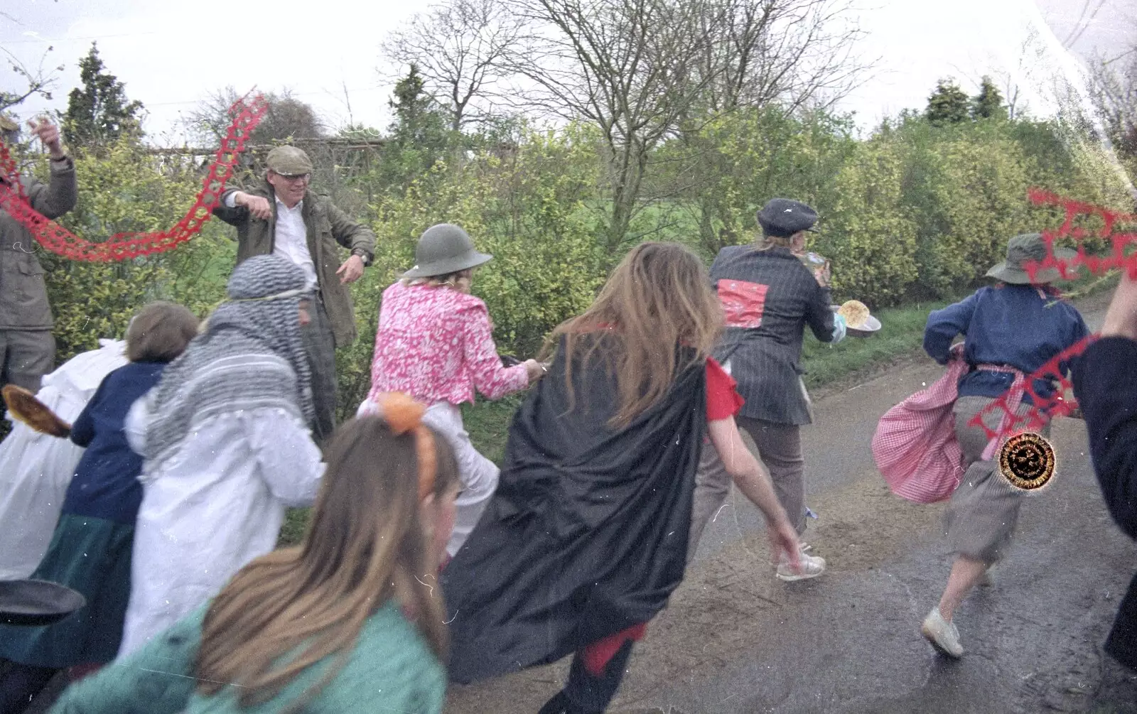 The ladies leg it down the lane, from Pancake Day in Starston, Norfolk - 27th February 1990