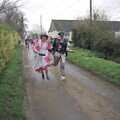 Elteb and Kim Archer run for it, Pancake Day in Starston, Norfolk - 27th February 1990