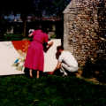Outside the church, Baz and Isobel set up some tapestry so that Baz can photograph it