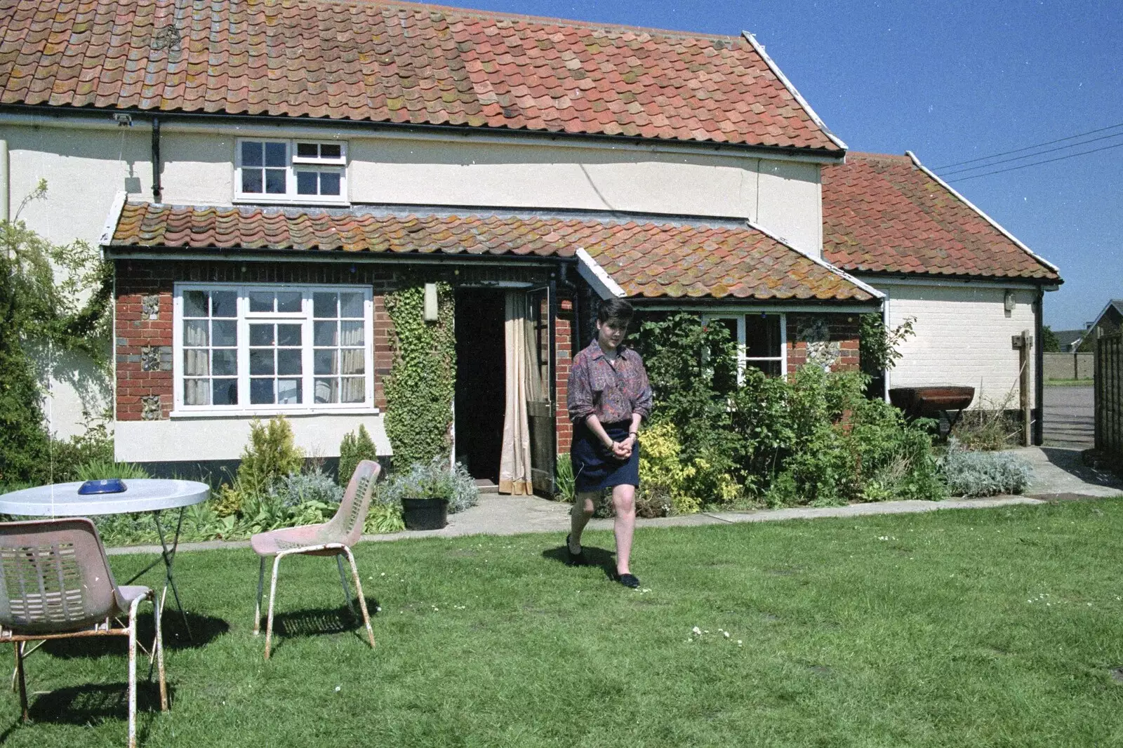 Kelly comes out from the White Hart, from Kelly's Printec Birthday, Roydon, Norfolk - 2nd May 1990