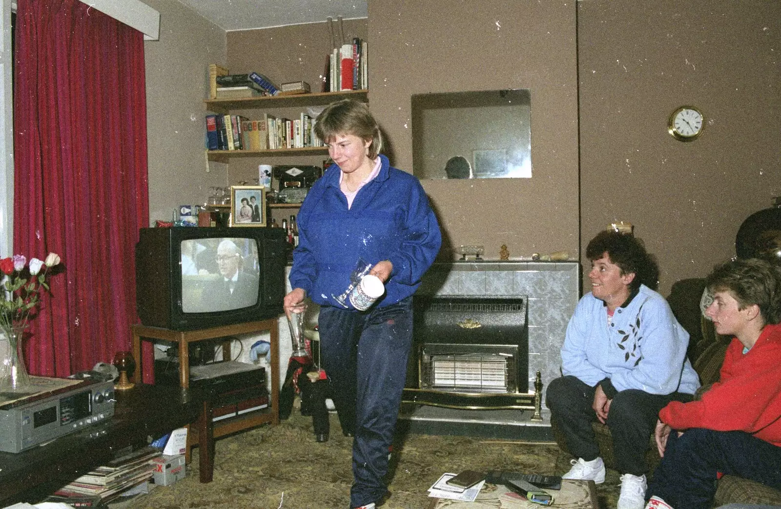 Sarah tidies up, from An "Above The Laundrette" Barbeque, Diss, Norfolk - 28th May 1990