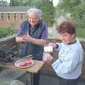 Crispy helps out by pouring a homebrew, An "Above The Laundrette" Barbeque, Diss, Norfolk - 28th May 1990