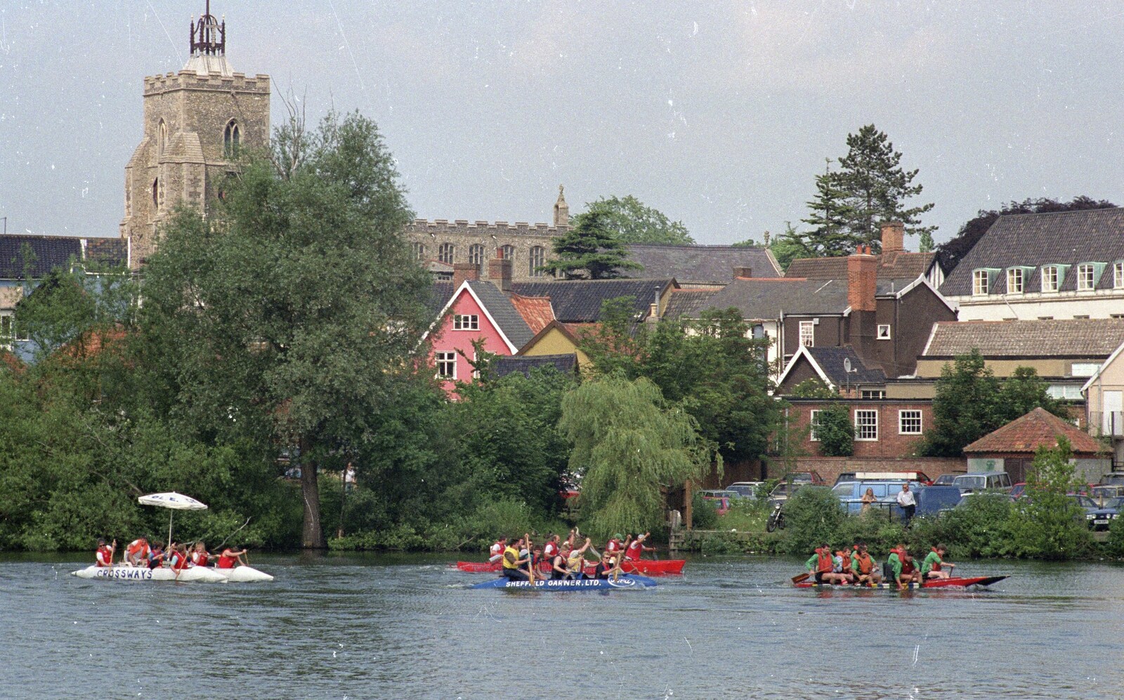 Rafts whizz around the Mere from A Raft Race on the Mere, Diss, Norfolk - 2nd June 1990