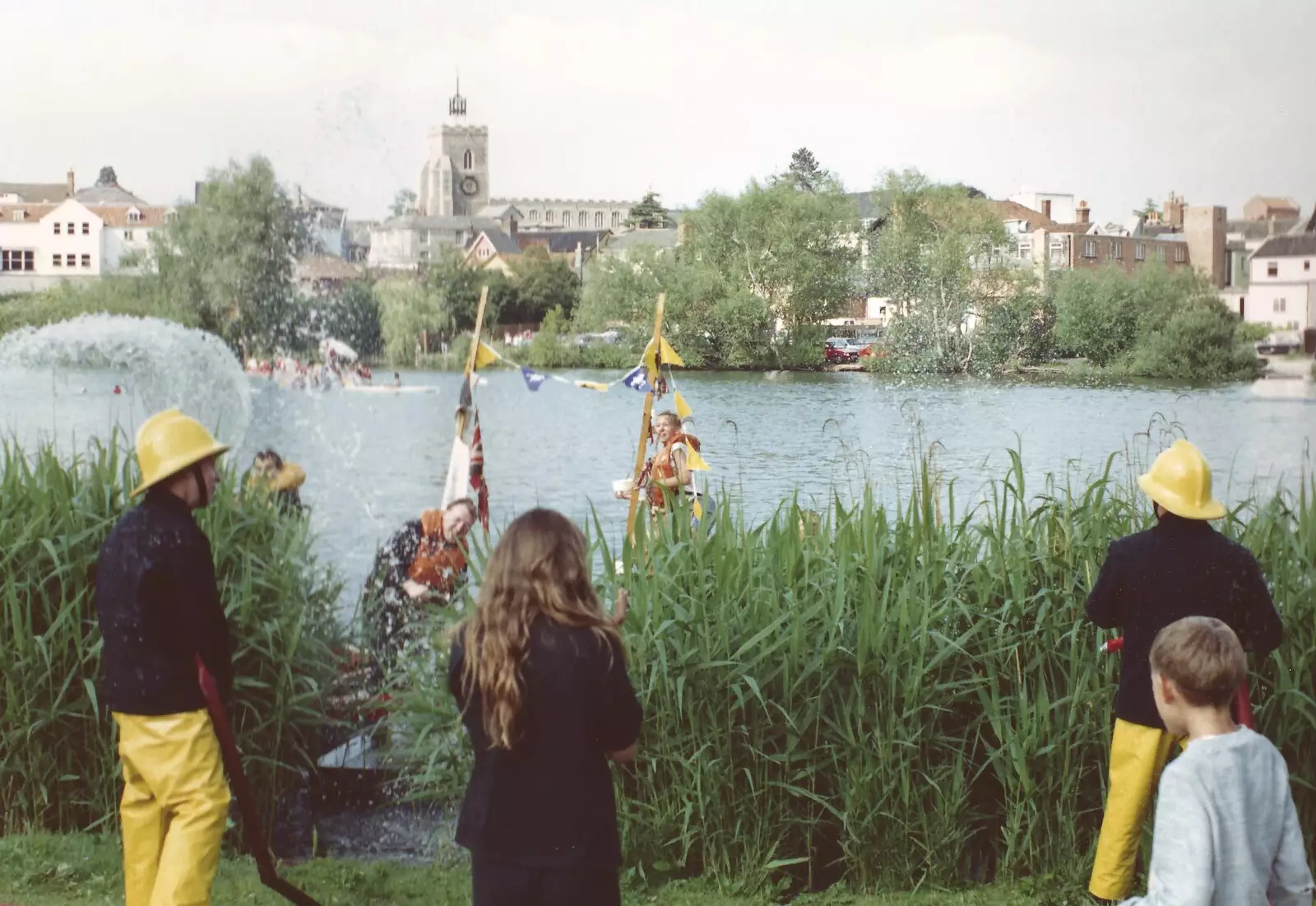 Firemen spray water over the rafters, from A Raft Race on the Mere, Diss, Norfolk - 2nd June 1990