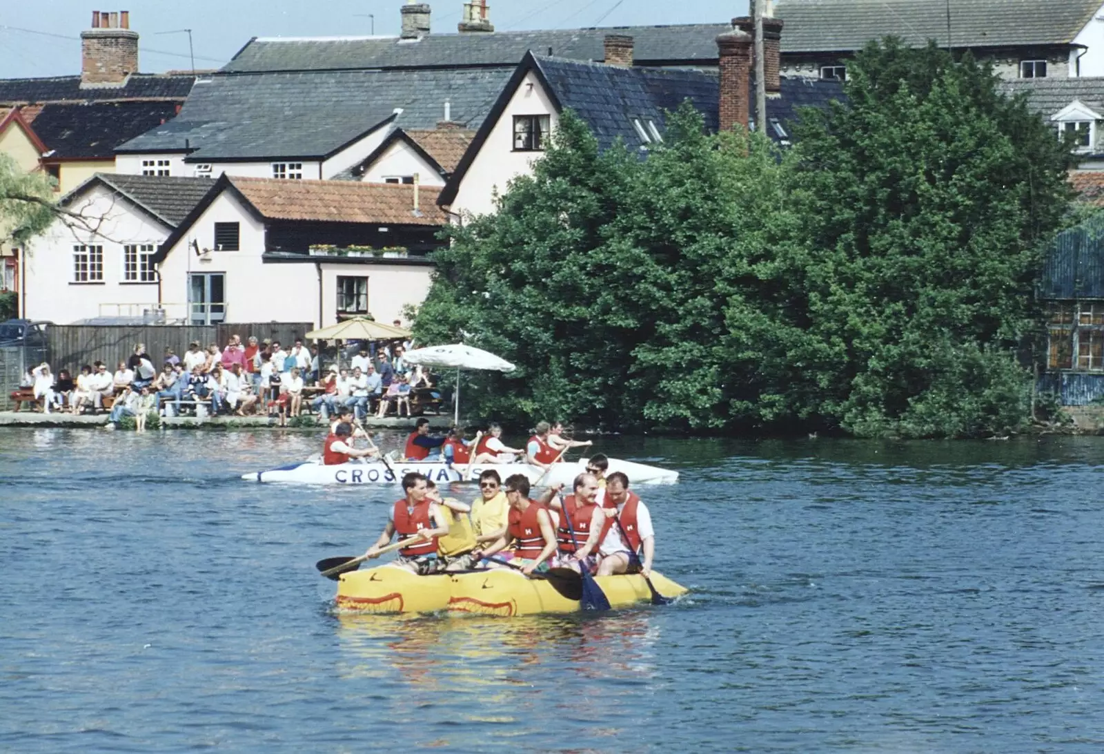 The yellow catamaraft is still going, from A Raft Race on the Mere, Diss, Norfolk - 2nd June 1990