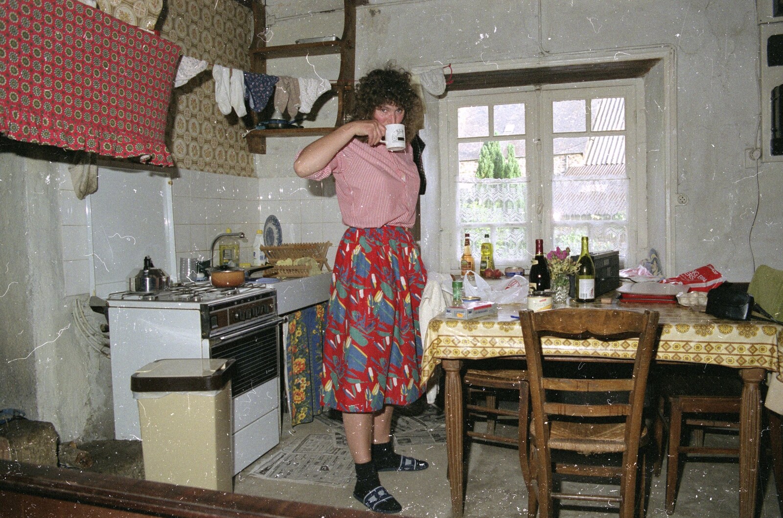 A Trip To Huelgoat, Brittany, France - 11th June 1990: Angela has a cup of tea in the kitchen half of the cottage