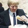 Alan Cox scoffs a hot dog 