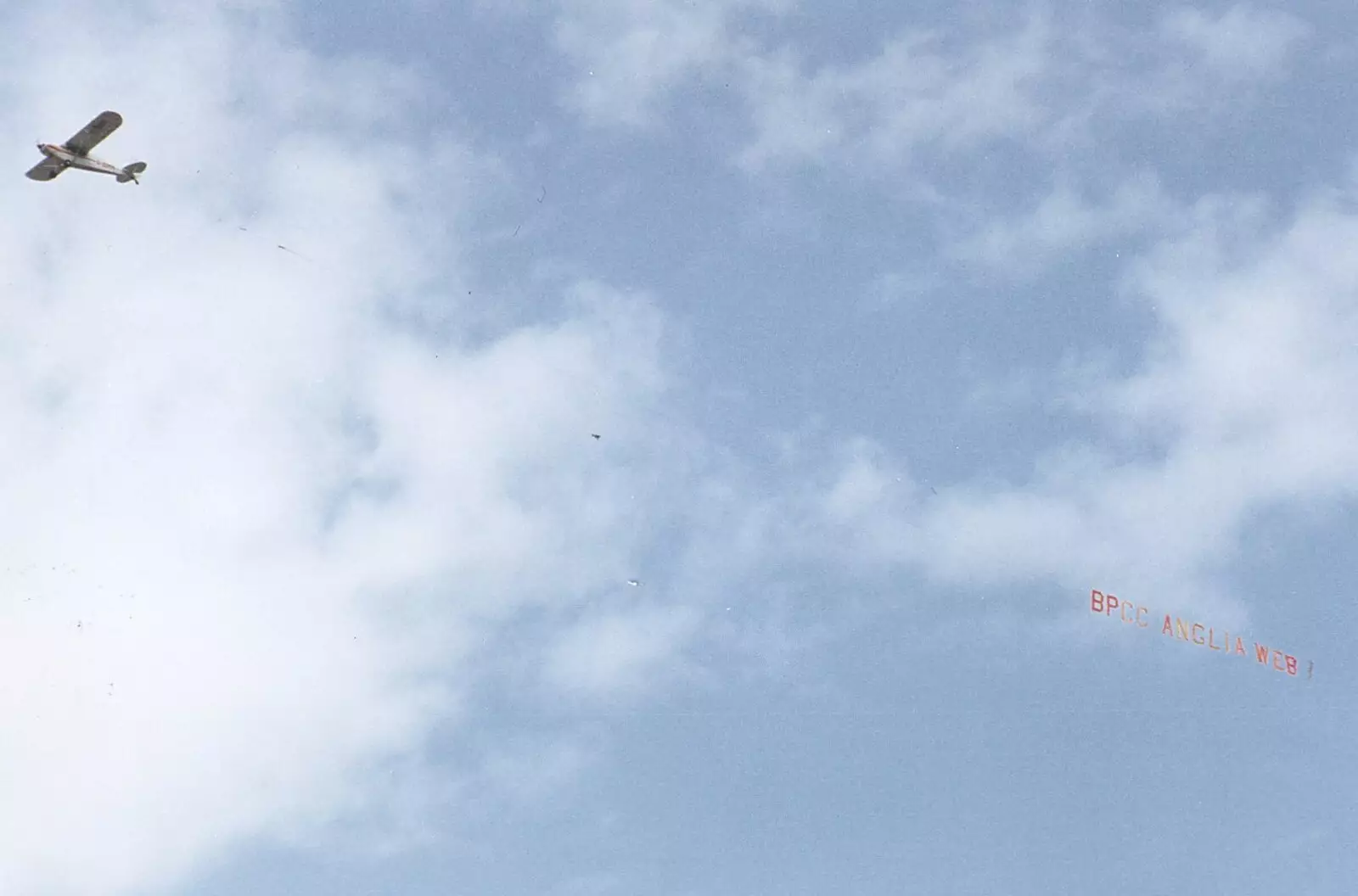 A Cessna flies past with a 'BPCC Anglia Web' banner, from BPCC Anglia Web Open Day, Diss, Norfolk - 23rd June 1990