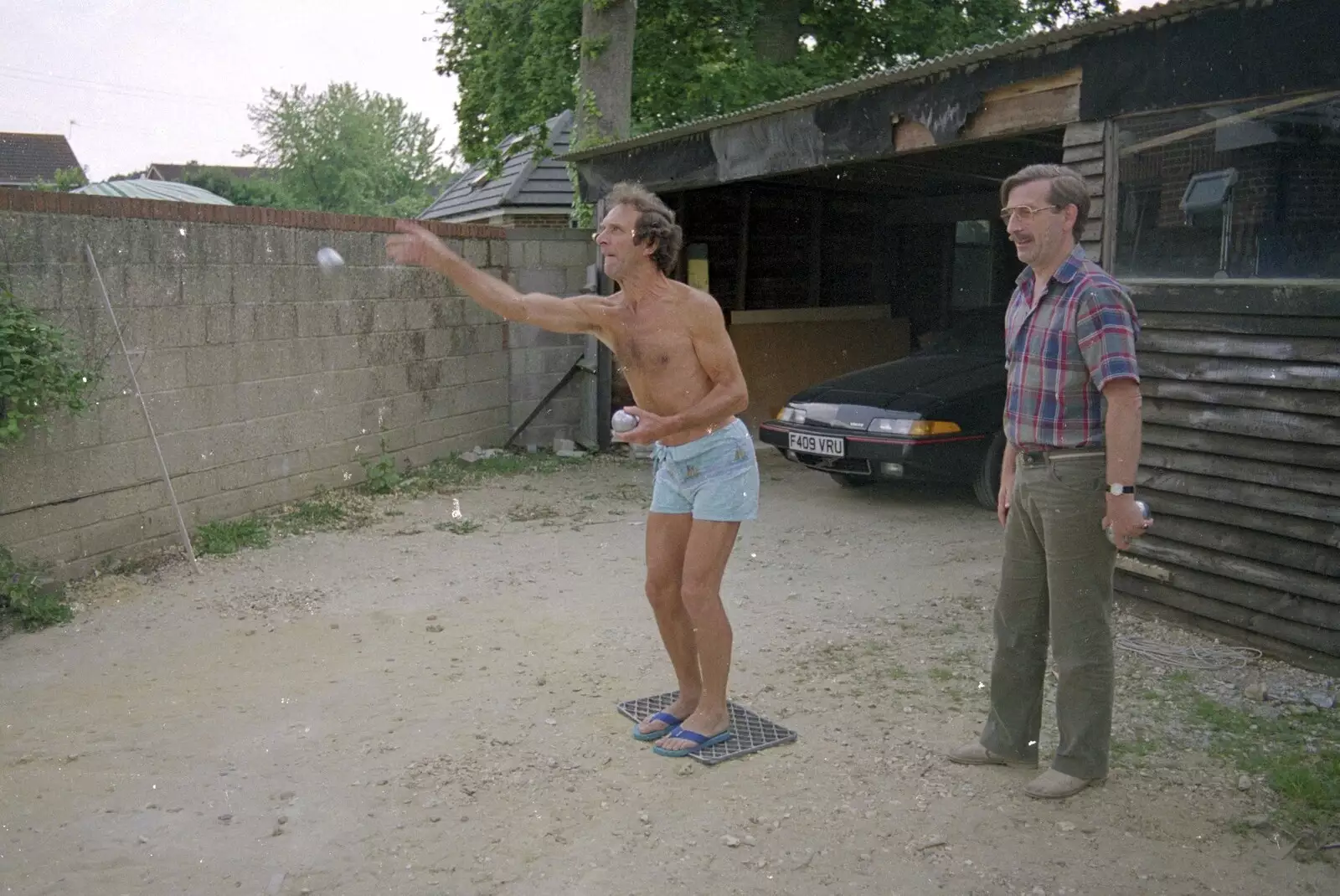 Mike lobs a ball, from Petanque At The Willows, Bransgore, Dorset - 10th July 1990