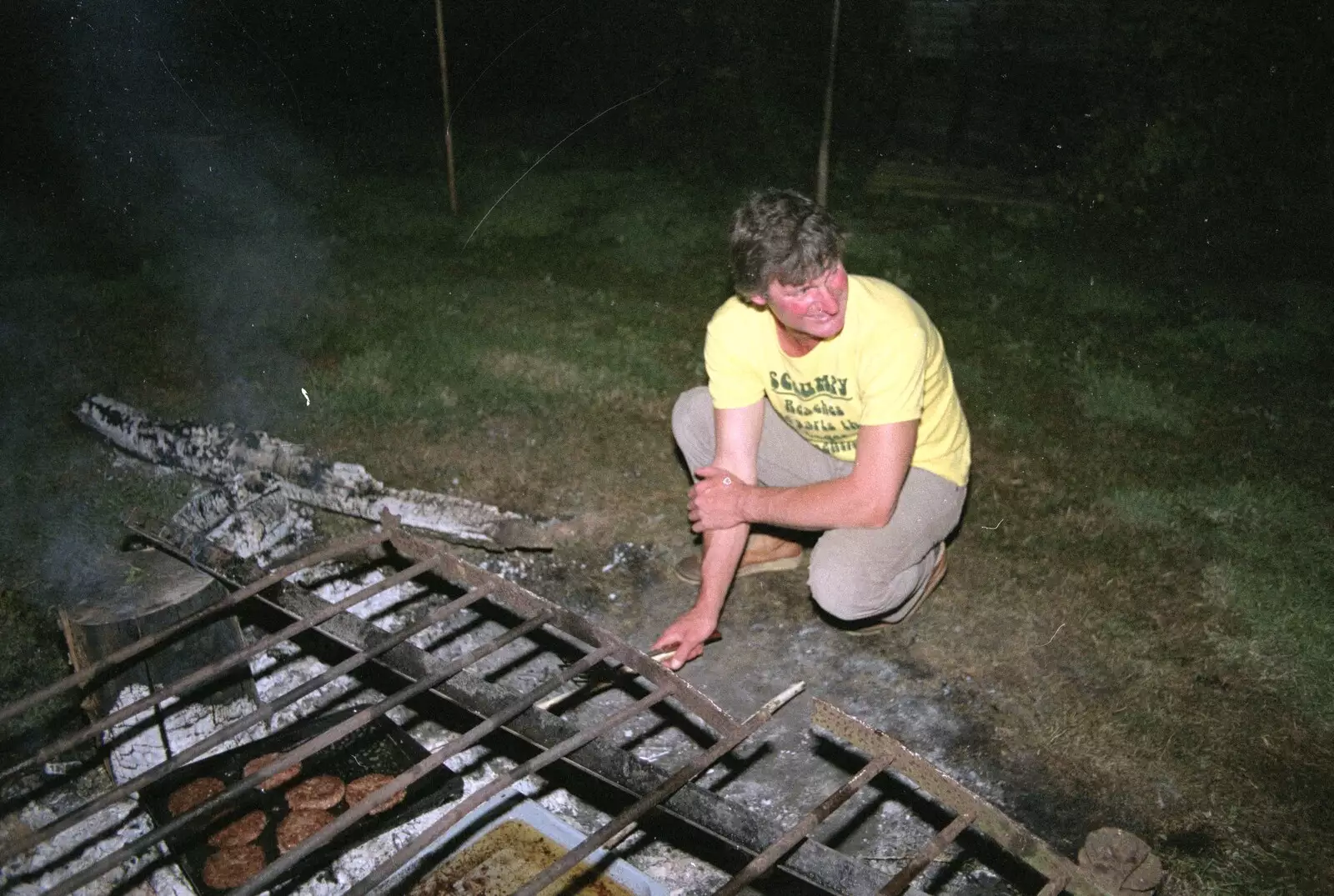 Geoff checks the burgers, from Sue's Fire Dance, Stuston, Suffolk - 21st July 1990