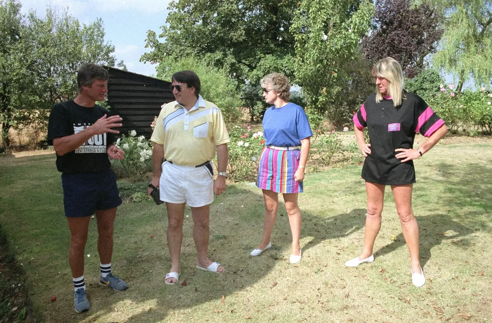 Geoff, Corky, Linda and Sue chat in the garden, from Sue's Fire Dance, Stuston, Suffolk - 21st July 1990