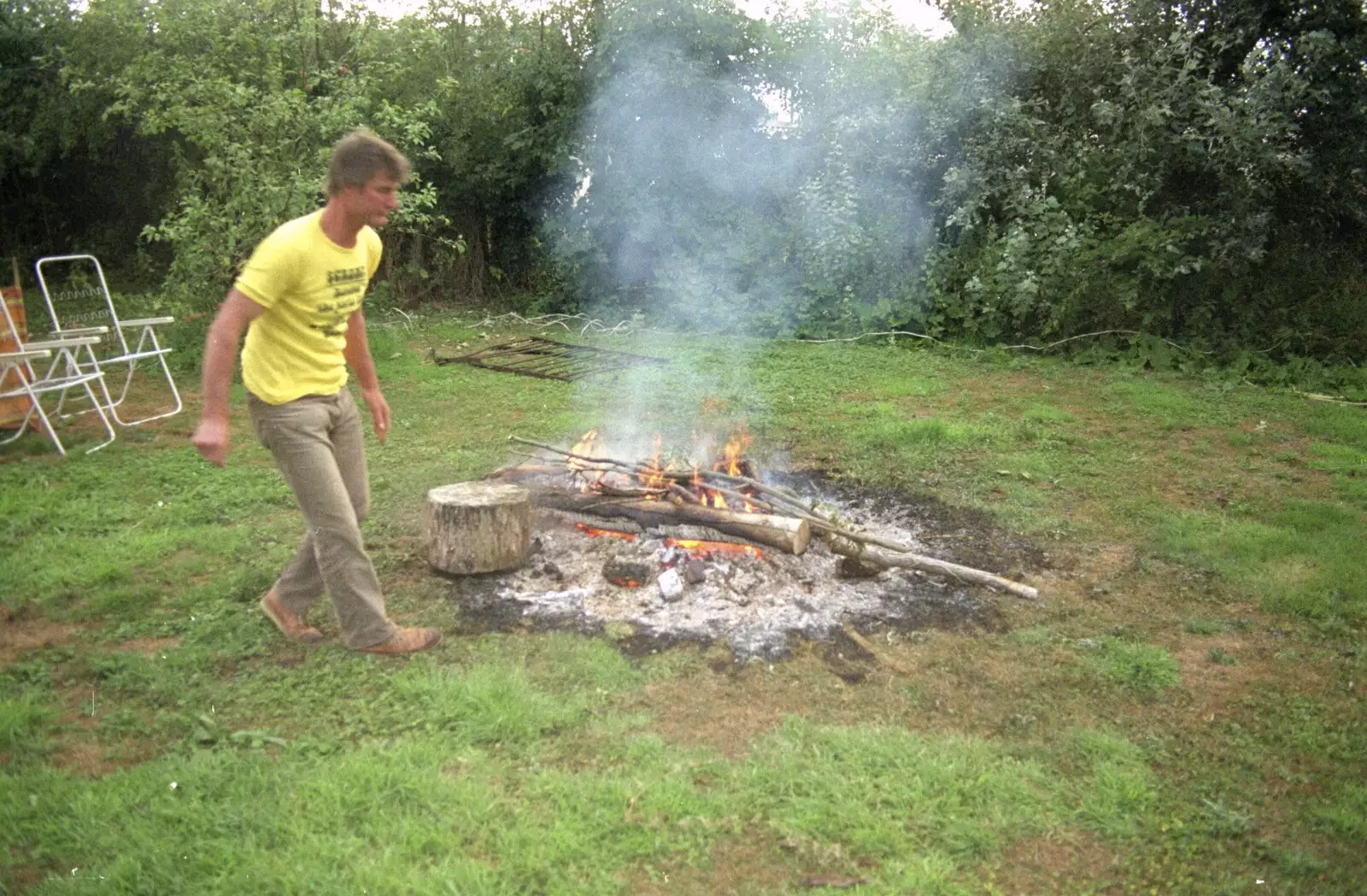 Geoff checks the fire, from Sue's Fire Dance, Stuston, Suffolk - 21st July 1990