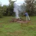 Brenda squirts the fire with a hosepipe, Sue's Fire Dance, Stuston, Suffolk - 21st July 1990