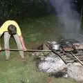 Geoff pokes the barbeque with a long stick, Sue's Fire Dance, Stuston, Suffolk - 21st July 1990